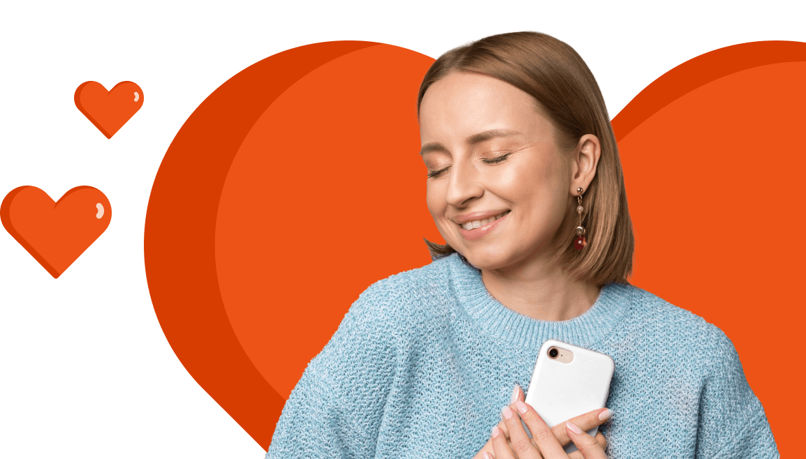 Woman holding her mobile phone to her chest surrounded by heart symbols